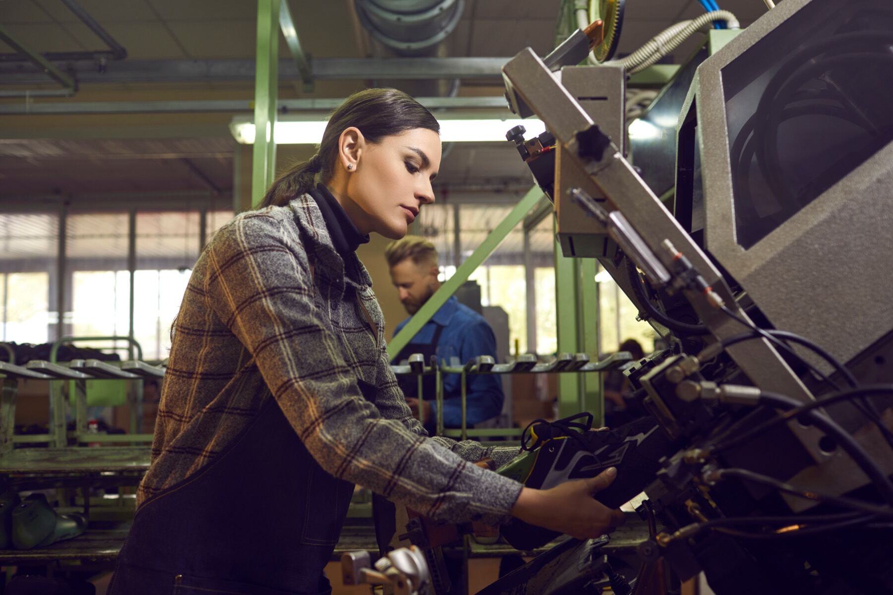 Machine operator working on a production line at a verified partner factory