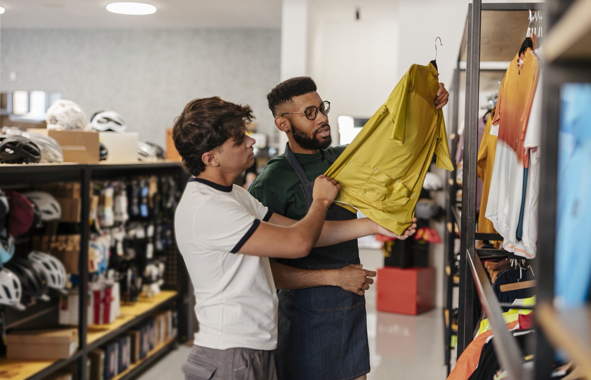 Two people inspecting a garment in an apparel shop