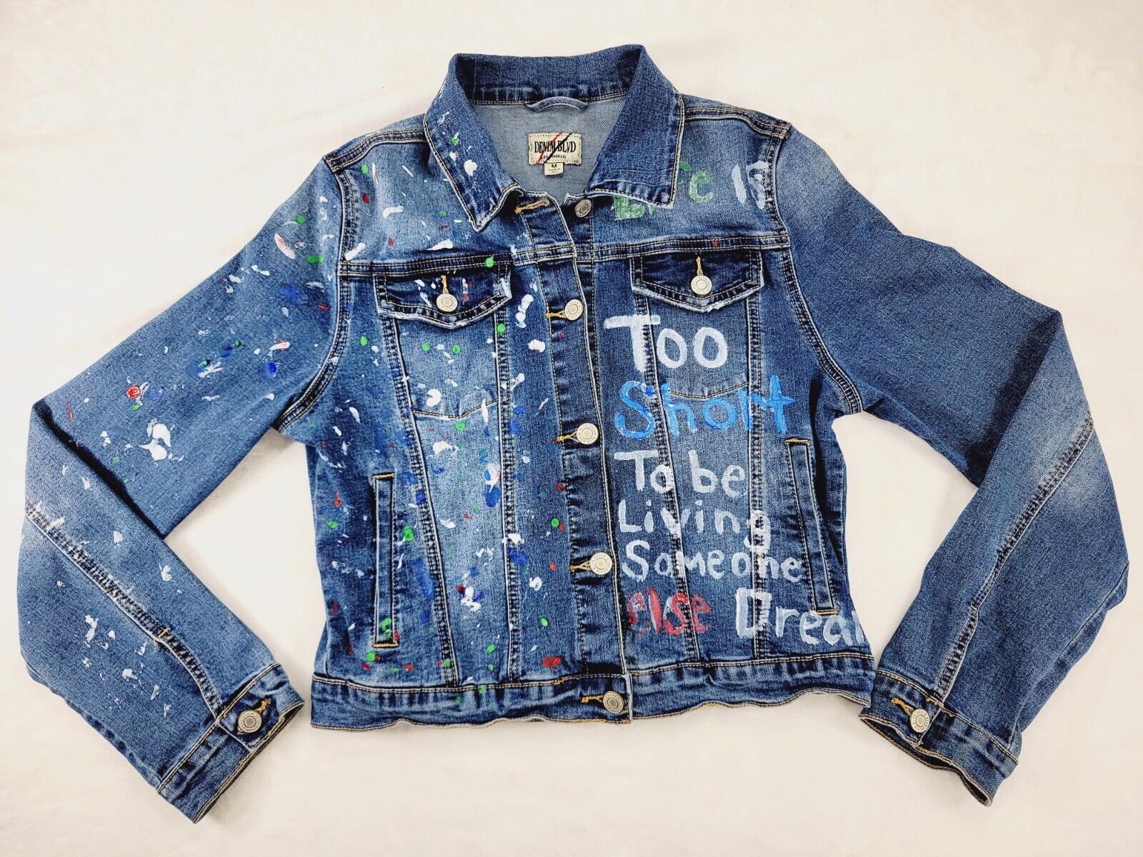 Denim jacket with custom design and logo